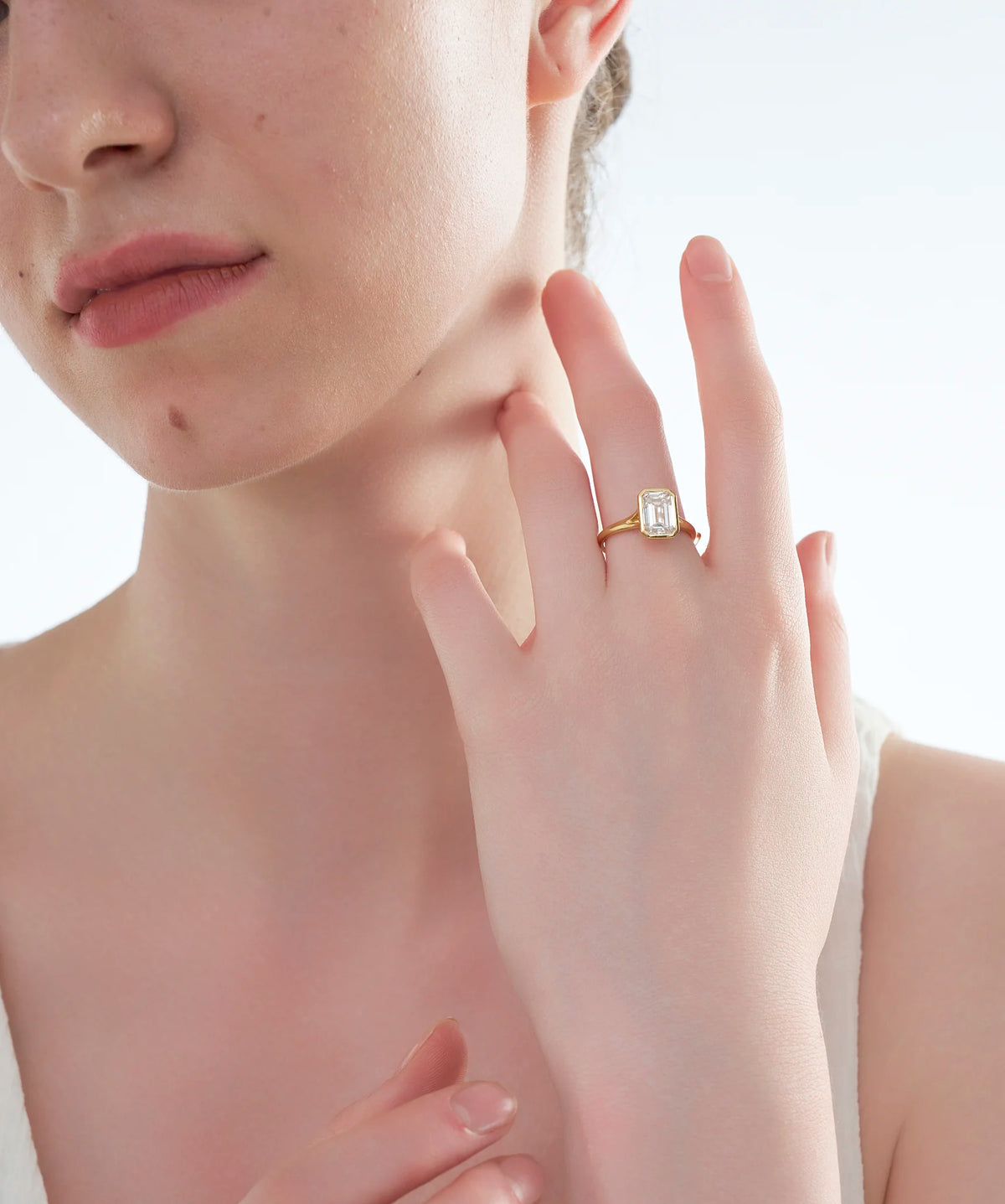 Bezel Set Emerald Cut Lab Grown Diamond Solitaire Ring in Gold