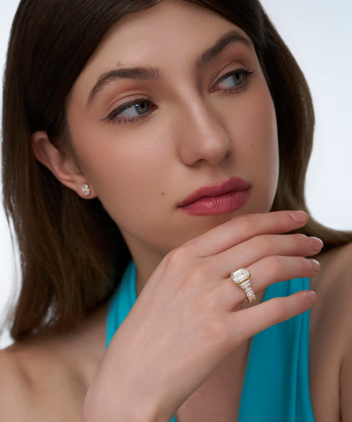 Emerald Cut Three Stone Ring with Trapezoid Sides
