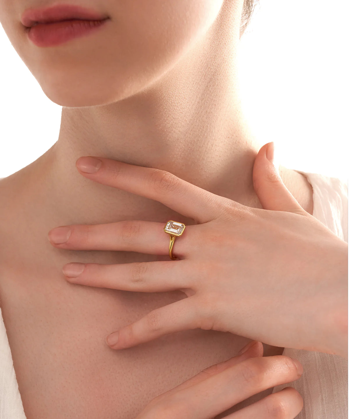 Bezel Set Emerald Cut Lab Grown Diamond Solitaire Ring in Gold