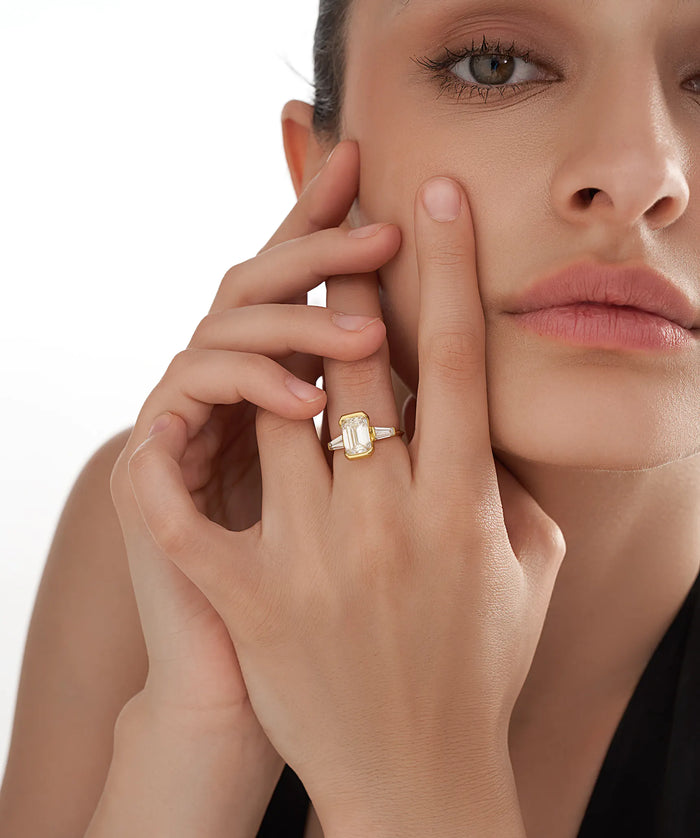 Half Bezel Emerald Cut Lab Grown Diamond Ring with Tapered Baguettes in Gold
